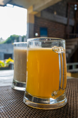 orange and banana juice on table