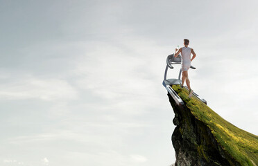 Obraz premium Man running on a treadmill concept