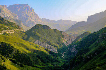 Traveler hiking in mountains clouds landscape