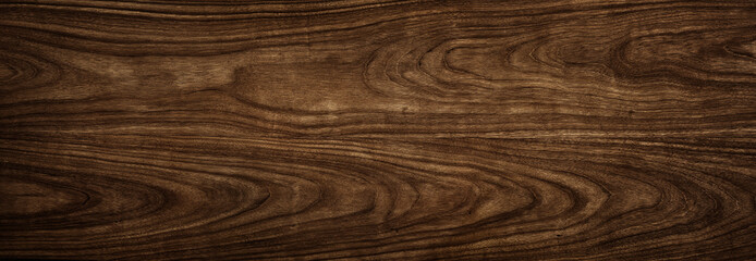 Wood tree texture close up. Wide walnut wood texture background. Walnut veneer is used in luxury...