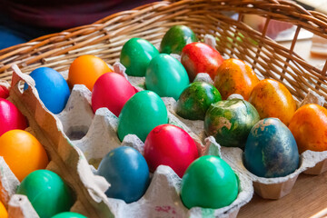 Egg cartons with Easter eggs dyed by children themselves.