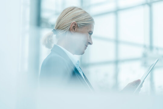 Businesswoman using tablet PC in office