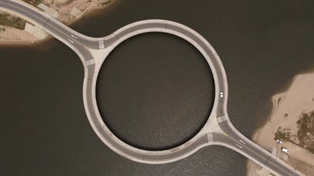Aerial top down showing famous Laguna Garz&oacute;n Bridge with circular shape. Located in Garz&oacute;n, Uruguay, and was designed by renowned Uruguayan architect Rafael Vi&ntilde;oly