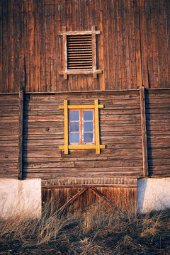 old wooden barn with a routed window