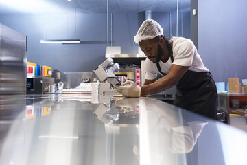 Chef writing in notebook after working day