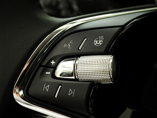 Modern car multifunction steering wheel. Milky and comfortable multimedia control function, volume,...