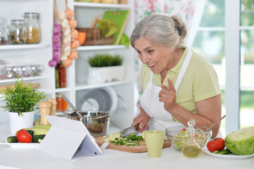 Senior woman chef portrait at kitchen