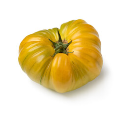 Single yellow coeur de boeuf tomato isolated on white background 