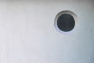 Plastic round window in wall