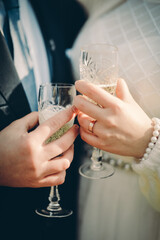 bride and groom holding champagne glasses