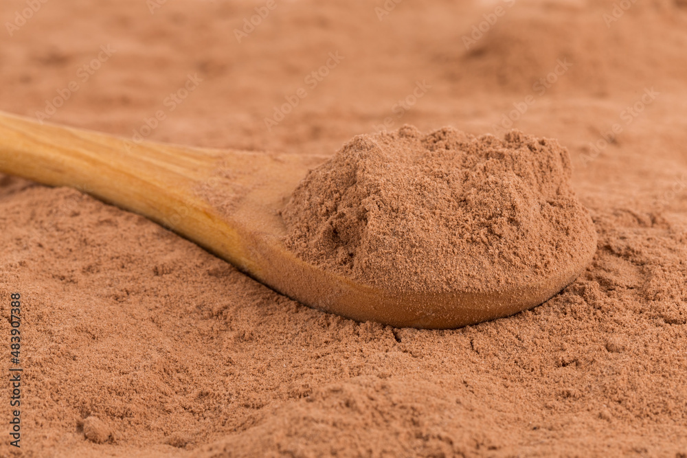 Wall mural cocoa powder closeup background