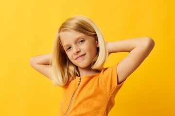 Young blonde girl blonde straight hair posing smile fun childhood lifestyle unaltered