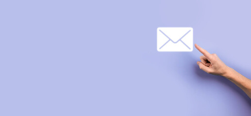 Businessman hand holding e-mail icon, Contact us by newsletter email and protect your personal...