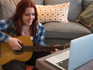 young woman singing a song on a video call.