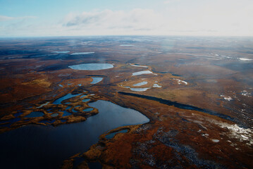 Aerial view and top view of the Lake in the tundra on the Taimyr Peninsula in Russia. Beautiful natural background. Blurred image, selective focus