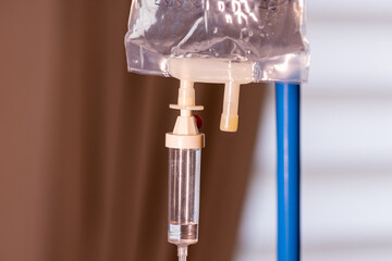 saline water or medicine or chemotherapy drops machine or medical instruments for infusion to blood vessel and for treatment sick or patient healthcare in hospital or clinic on window sunlight with