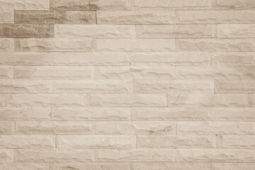 Empty background of wide cream brick wall texture. Beige old brown brick wall concrete or stone design backdrop.