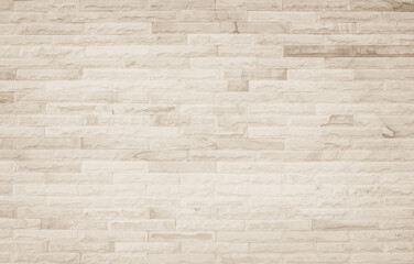 Empty background of wide cream brick wall texture. Beige old brown brick wall concrete or stone design backdrop.