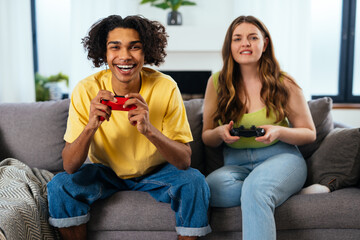modern multiethnic unstereotyped couple lifestyle moments at home. Not stereotyped boyfriend and...