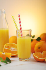 Fototapeta na wymiar Oranges and orange juice in glasses 