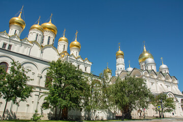 Fototapeta na wymiar 17th century golden domed white churches of the Moscow Kremlin in summer, Russia
