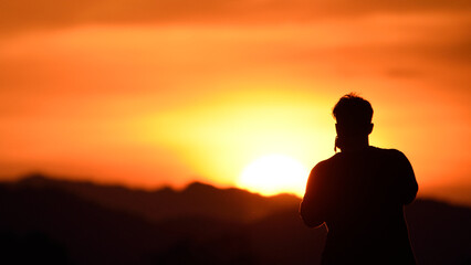 Fototapeta premium silhouette photographer man with sunset background.