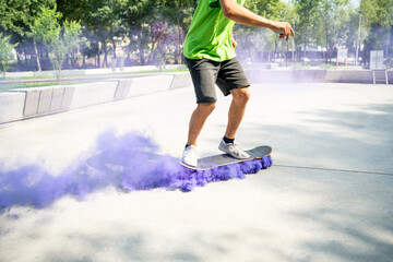 Group of teenagers having fun at the skatepark doing skateboarding and tricks . skaters with colored smoke bombs © oneinchpunch
