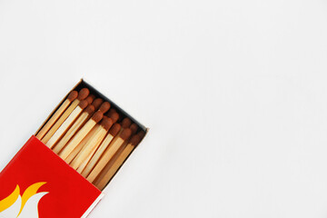 wooden matches for lighting a fire in a paper box