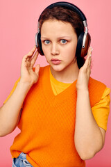 portrait of a young woman headphones music fashion posing isolated backgrounds unaltered