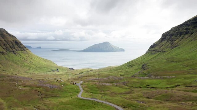 Aerial view of wilderness nature,islands, ocean, green mountain and rock cliffs.Impressions of the fascinating archipelago of the Faroe Islands in the North Atlantic Ocean
