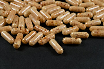 capsules of lecithin on a dark background