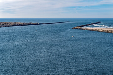 A boat going through the jetty at Newport, Oregon, USA
