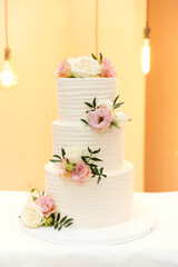 amazing wedding cake isolated on beautiful background. dessert at a wedding banquet. tiered cake