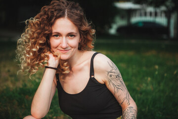 Portrait of curly-haired woman on the street