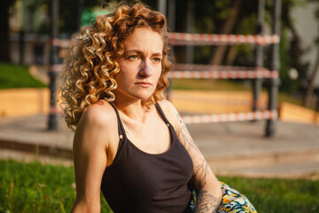Portrait of curly-haired woman on the street