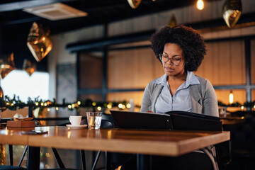 Focused adult woman with glasses, wishing to try some exquisite food.