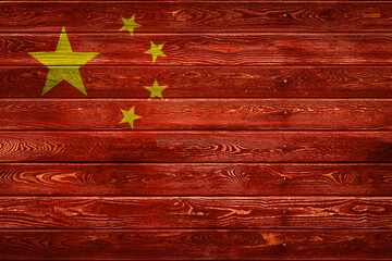 The national flag of China. is painted on a camp of even boards nailed with a nail. The symbol of...
