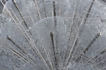 abstract figure of a water fountain on blurred background