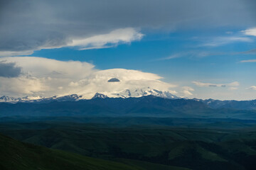 Obraz na płótnie Canvas View of Elbrus and the Bermamyt plateau in the Karachay-Cherkess Republic, Russia. The Caucasus Mountains.