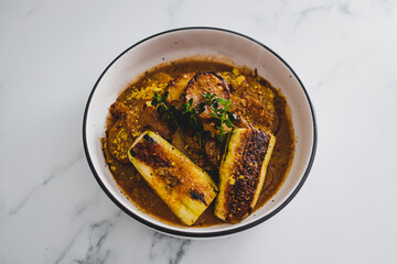 vegan potato roast with zucchini steak, healthy plant-based food