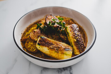 vegan potato roast with zucchini steak, healthy plant-based food