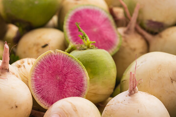 Watermelon red radish (Chinese daikon) on a shop window. View from above.