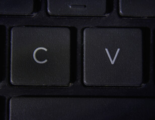 Computer keyboard with C and V key shallow depth of field photography