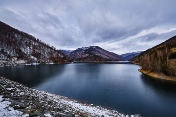 beautiful landscape with a mountain lake in winter