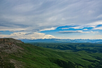 Obraz na płótnie Canvas View of Elbrus and the Bermamyt plateau in the Karachay-Cherkess Republic, Russia. The Caucasus Mountains.