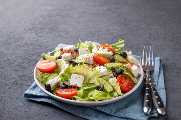 Healthy vegetables on a plate with fork and knife. Text space