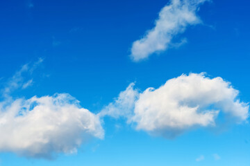 Naklejka na ściany i meble White clouds on a background of the sky with shades of blue