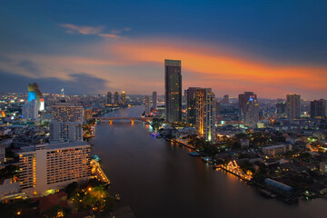 Fototapeta na wymiar Bangkok Cityscape at dusk. Landscape of Bangkok business building at economic zone. Thailand aerial modern building in business district area at twilight.
