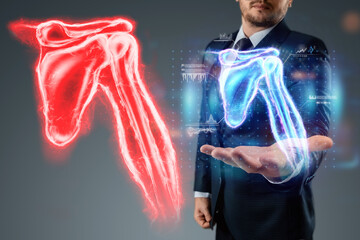 Medical poster, human body anatomy, shoulder joint x-ray, bones hologram. The doctor looks at the...