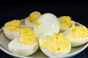 Stuffed egg yolk with mayonnaise in a white plate
